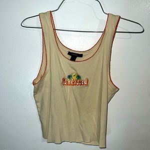 Tan crop top with “Sunkissed” on front